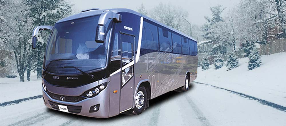 Modern Mt Buller tour bus parked in snowy alpine surroundings